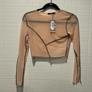 NWT. Pink mesh long sleeve crop top with black seam detail. See thru